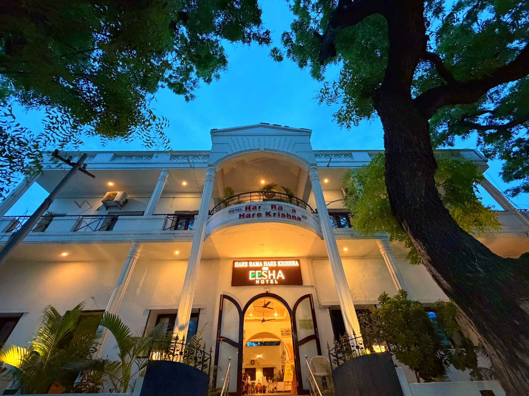 EESHA Hotels exterior at dusk