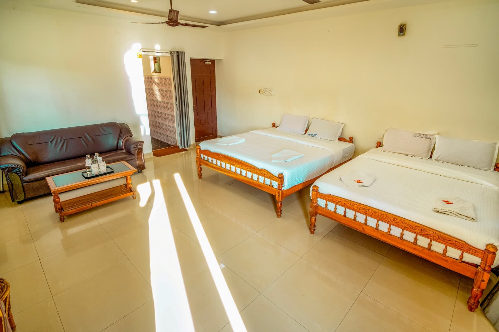 Family Room with Private Balcony, two double beds and sofa