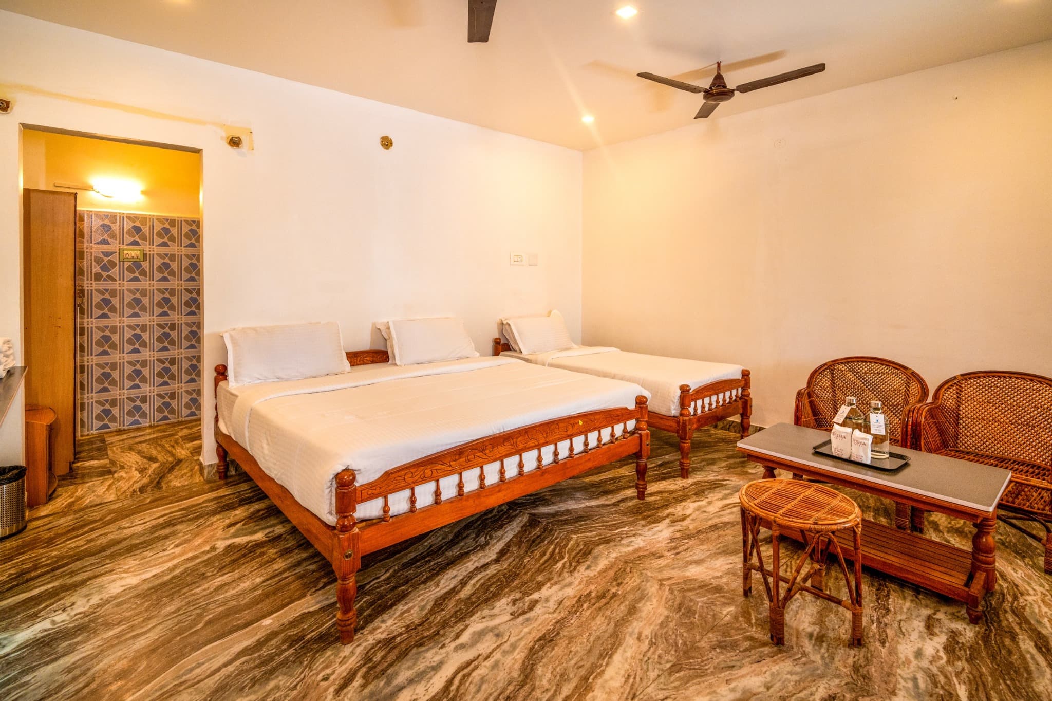 Triple Room with King and Single Bed, beds and cane seating