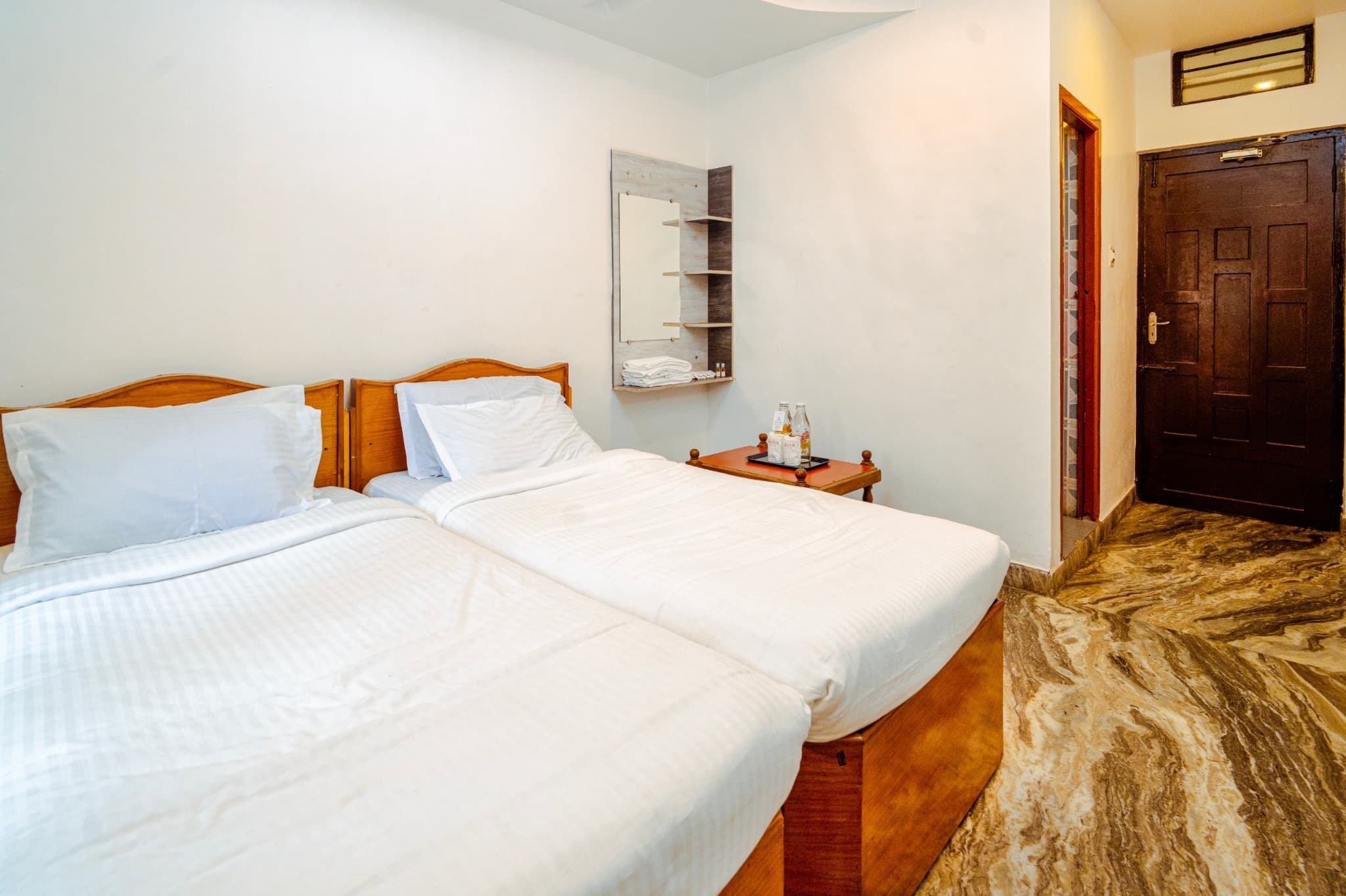 Twin Double Room, beds and entrance